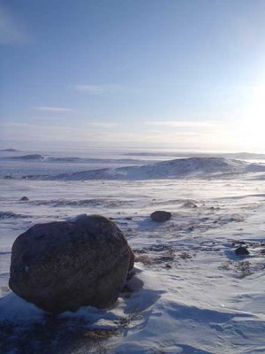 A big rock and a nice landscape. 