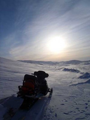 A snowmobile and a nice landscape.