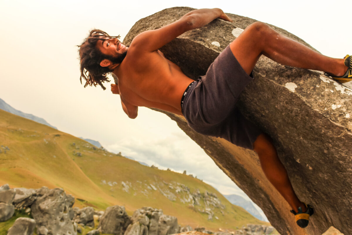 Samuel Thomsen climbing an under-hanging ledge in the South Island of New Zealand 